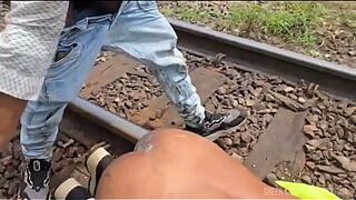 The workers were doing maintenance on a railway line, and the work was hard with a passive colleague in the middle of the tracks.